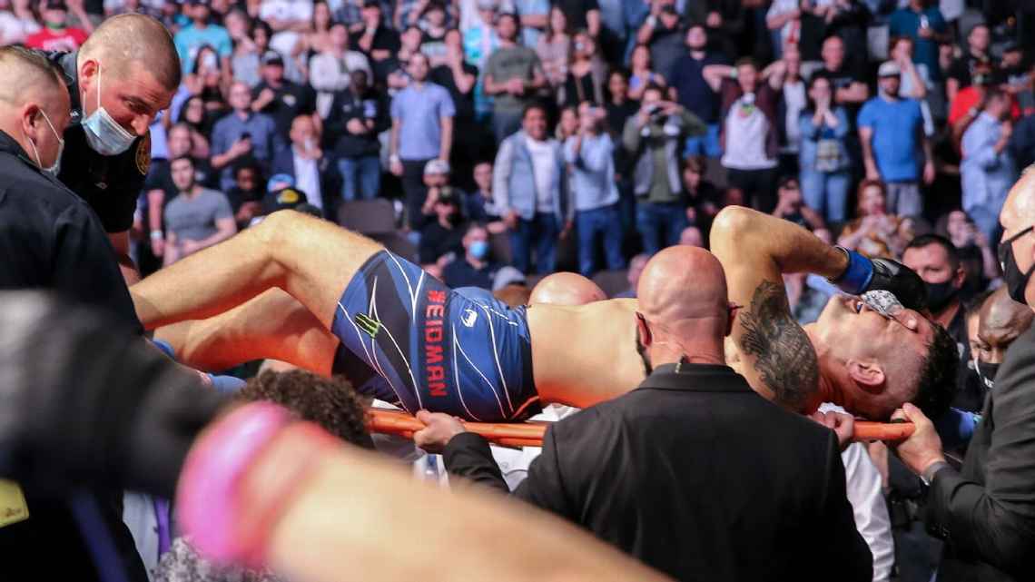 One title changes hands, Chris Weidman breaks leg at UFC 261
