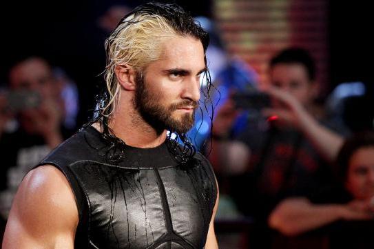 Seth Rollins carried from ring with possible knee injury