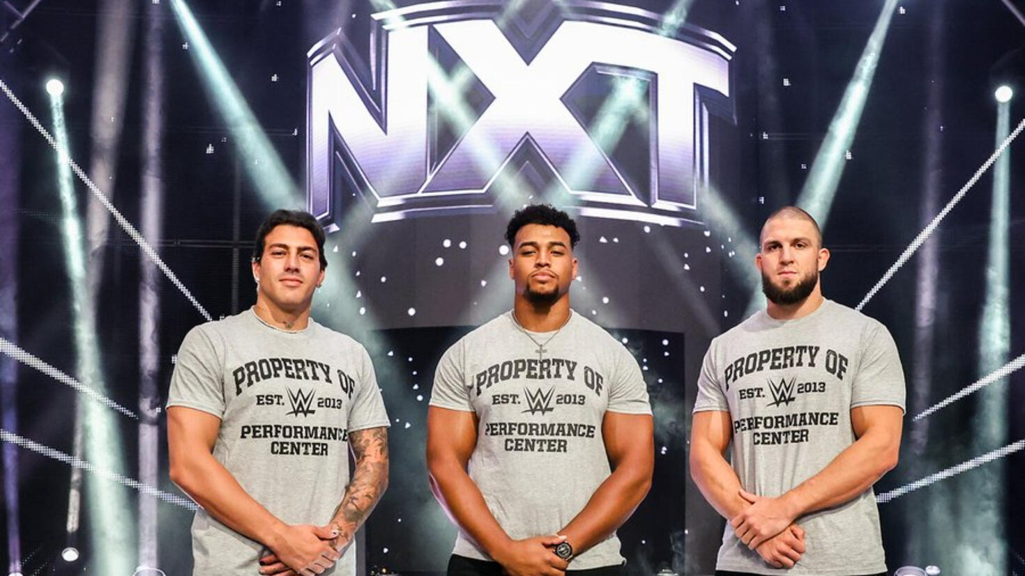 WWE touts signing of three Olympians