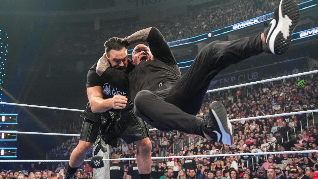Randy Orton performing his finisher RKO on Drew McIntyre
